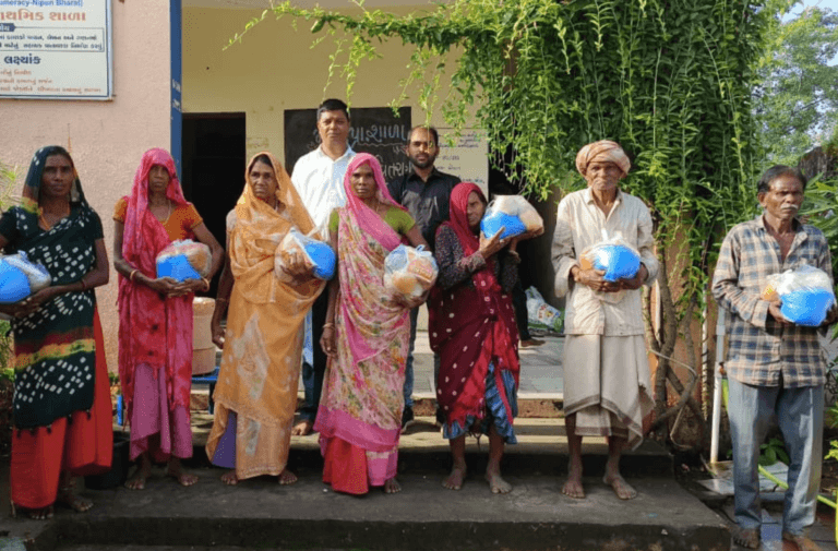 Distributes Food to Underprivileged Tribal Families in Dudhapur (Godhra)