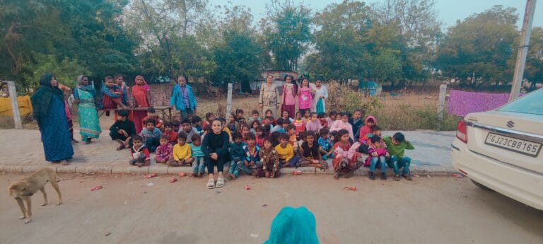 Distributes Sweaters to Slum Children in Mangalpura, Anand